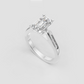 Luxury emerald cut engagement ring with polished gold band.