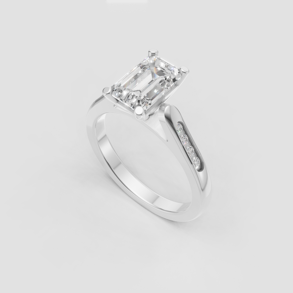 Luxury emerald cut engagement ring with polished gold band.
