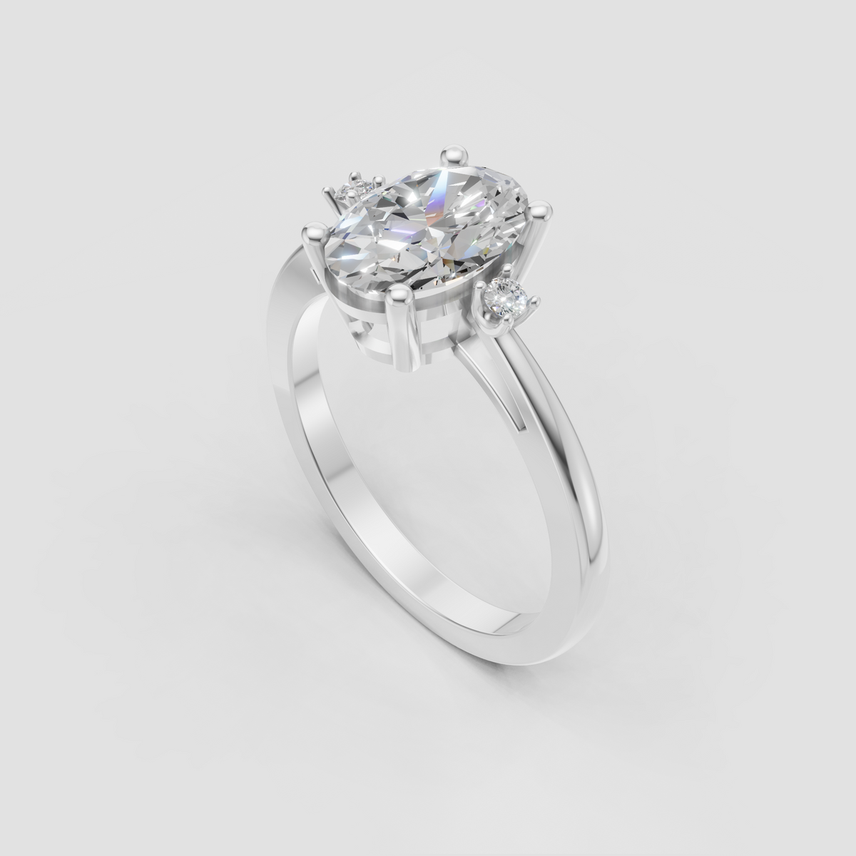 Six-prong oval diamond ring with two round shoulder stones