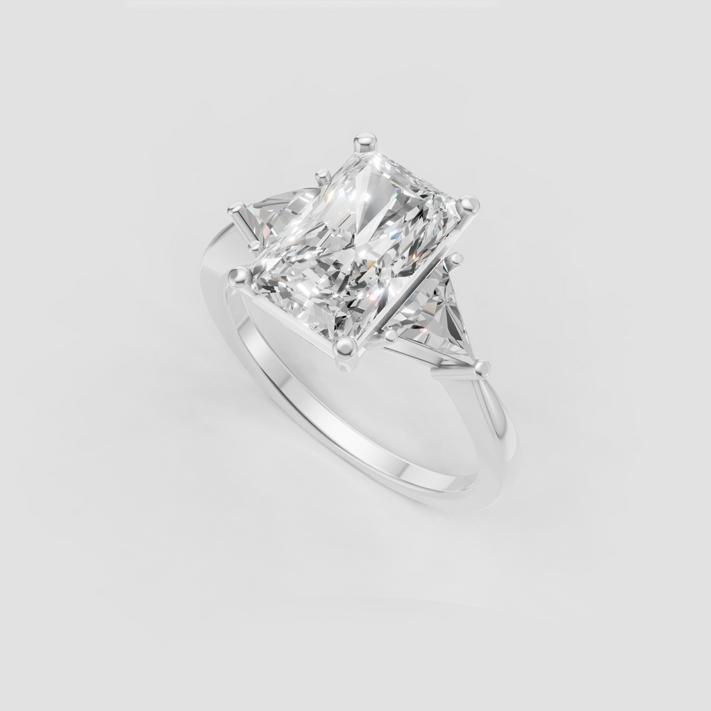 Elongated rectangular radiant diamond ring with triangular side diamonds