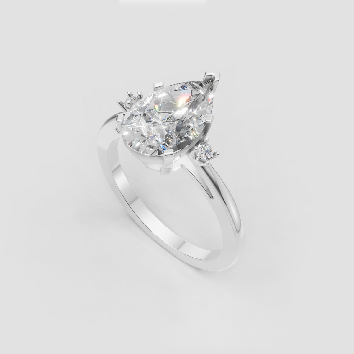 Pear cut center diamond with round accent stones