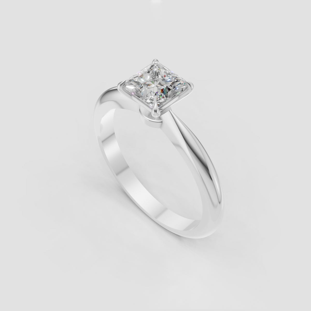 Four-prong princess cut diamond ring with polished gold finish