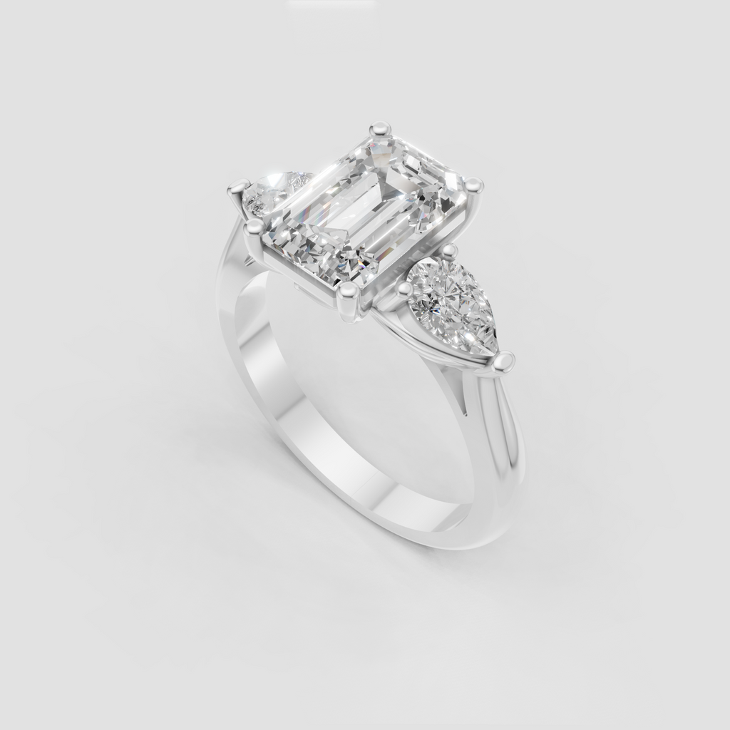 Emerald cut bridal ring with pear-shaped diamonds