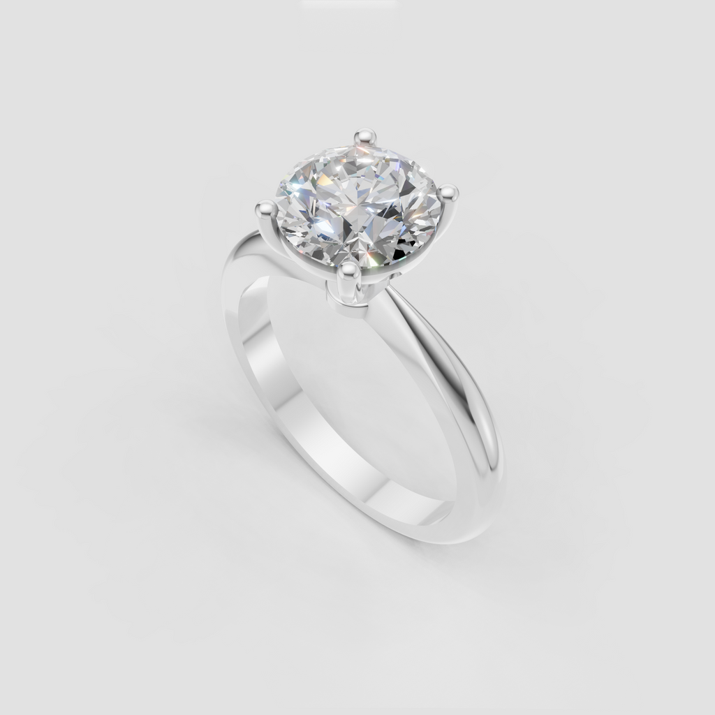 Four-prong round diamond ring with smooth polished yellow gold band