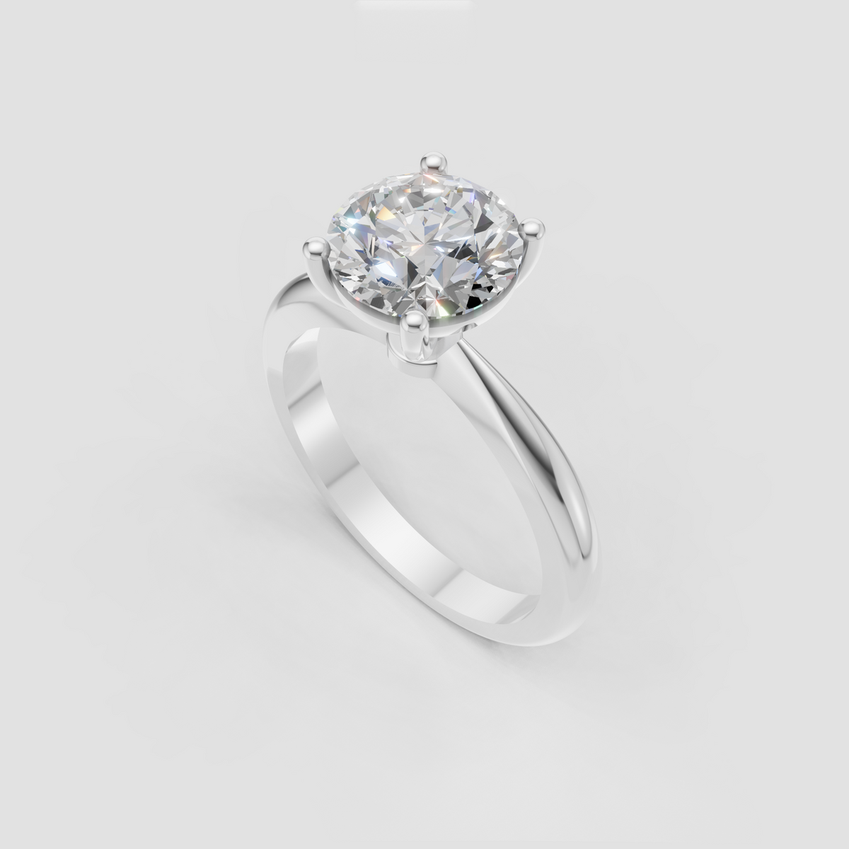 Four-prong round diamond ring with smooth polished yellow gold band