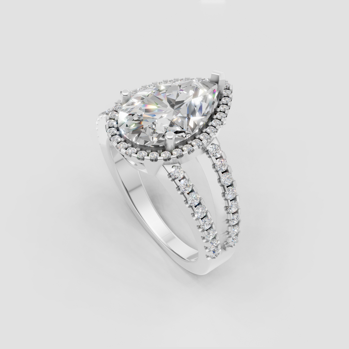 Pear cut diamond engagement ring with double pavé split-shank band