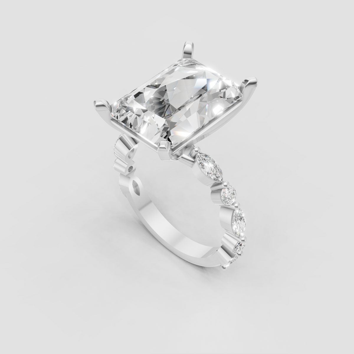 Elongated radiant cut diamond ring with brilliant side stone detailing
