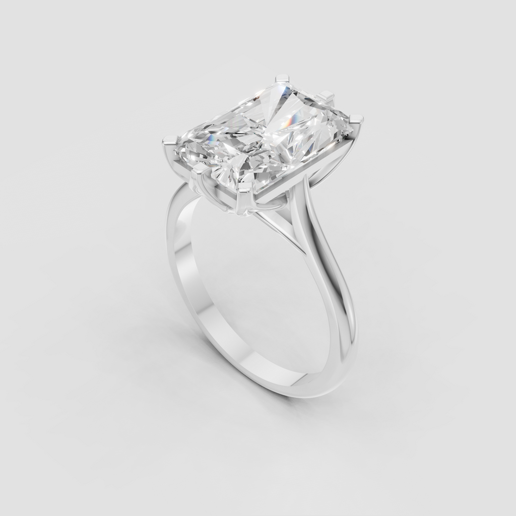 Elongated rectangular diamond engagement ring with cathedral setting