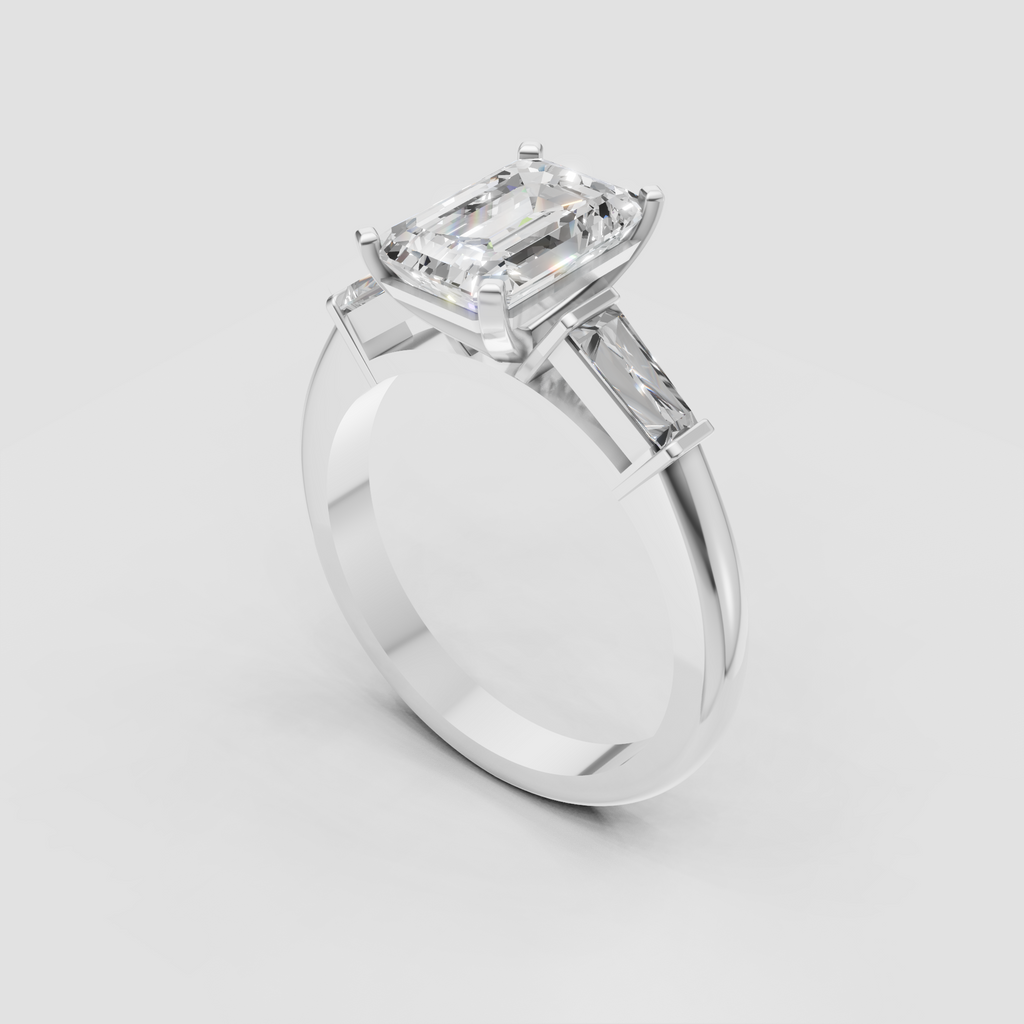 Emerald cut diamond engagement ring featuring tapered baguette accents