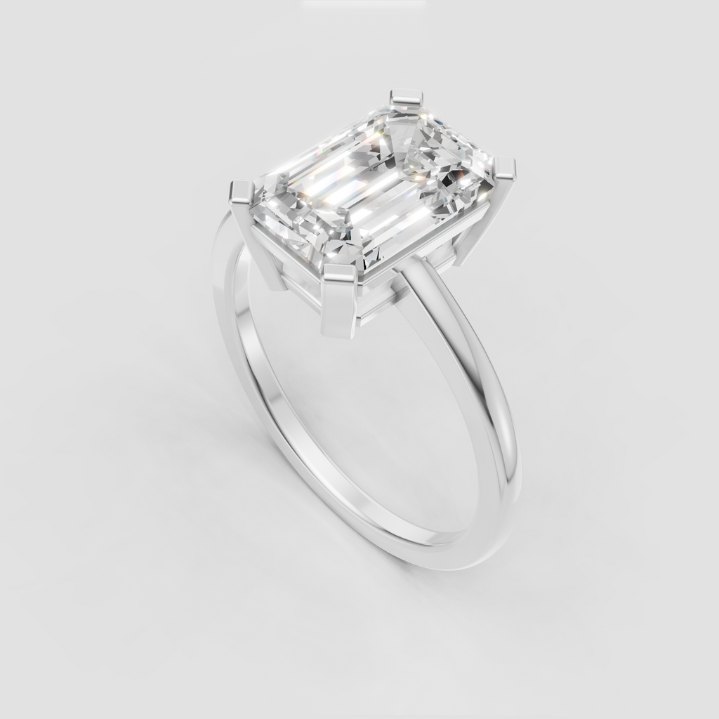 Emerald cut diamond four prong ring