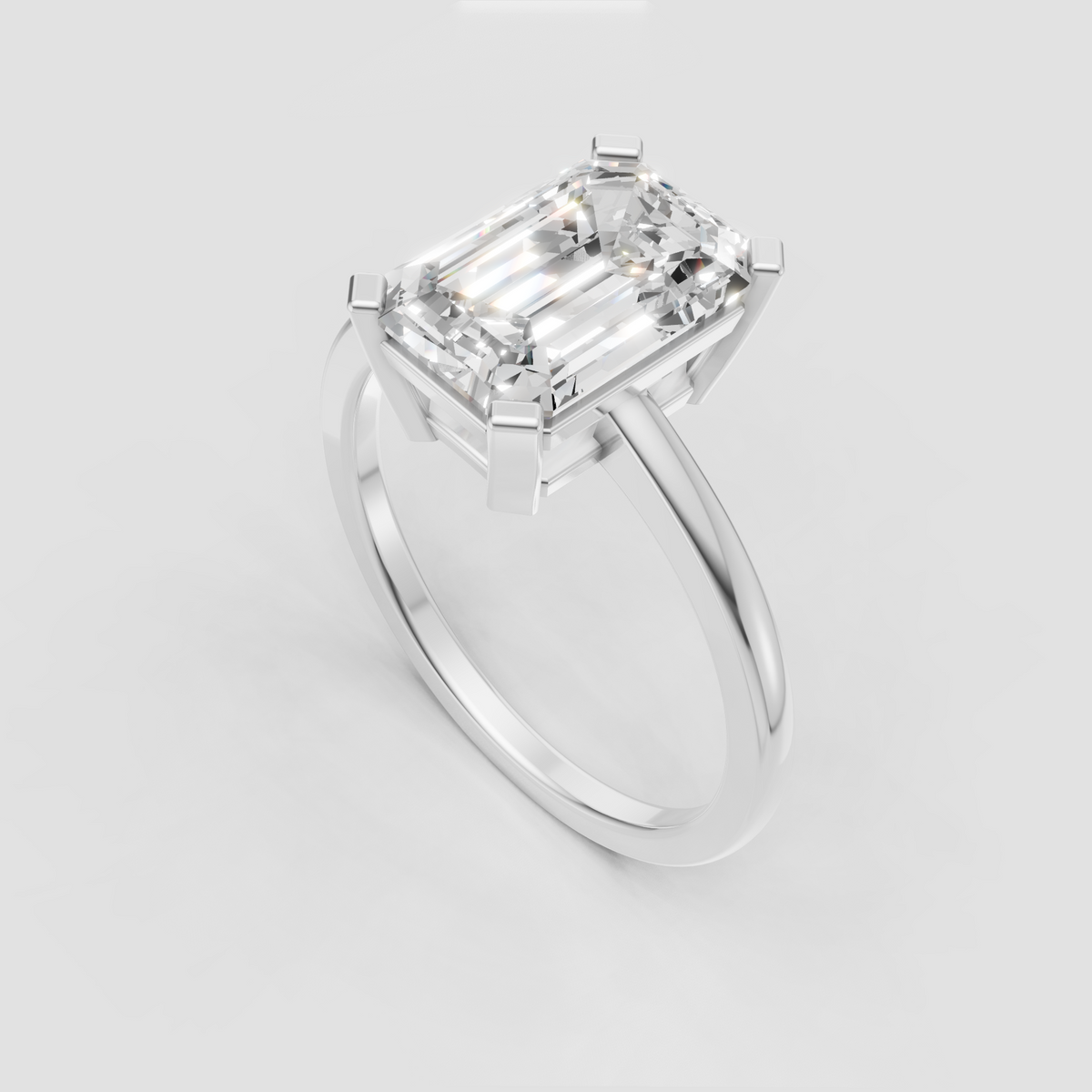 Emerald cut diamond four prong ring