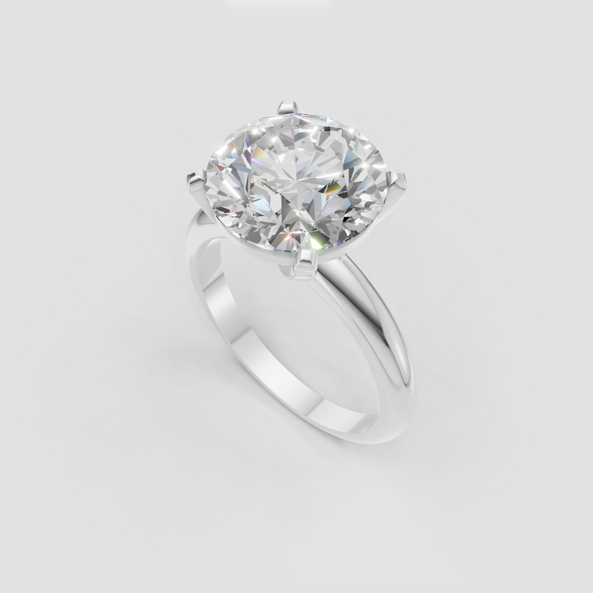 Round cut diamond secured in four-prong solitaire setting