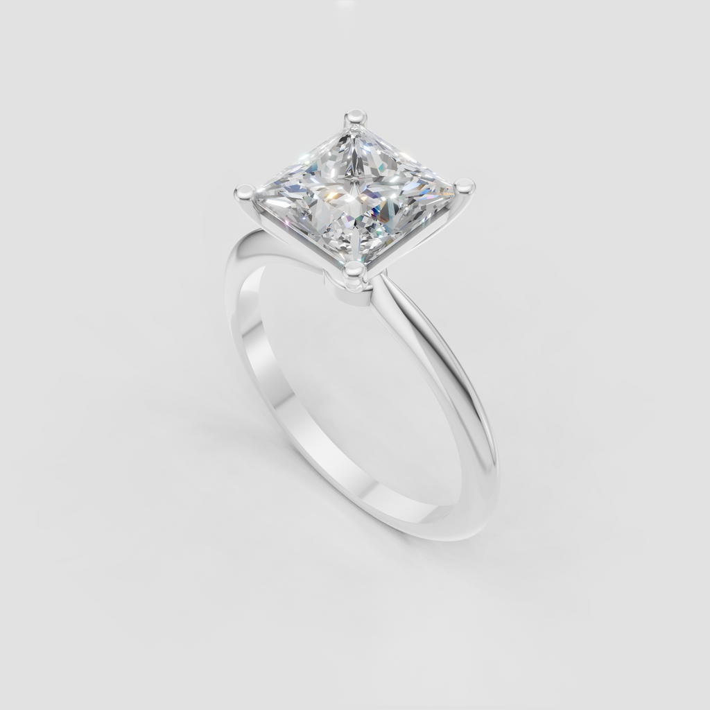 Classic princess diamond solitaire ring with a clean polished gold band