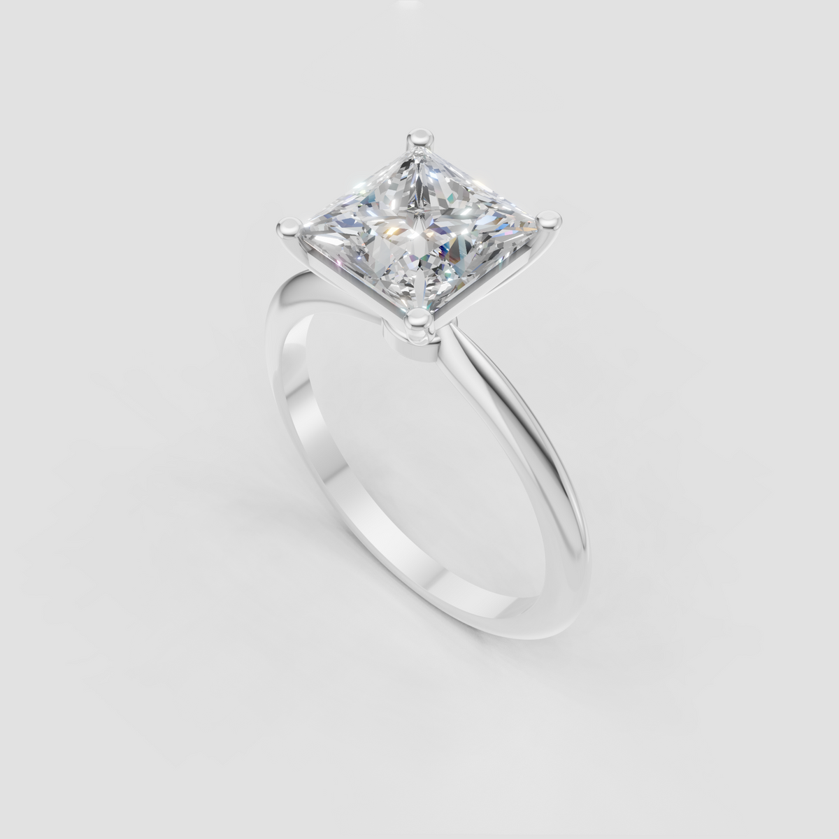 Classic princess diamond solitaire ring with a clean polished gold band
