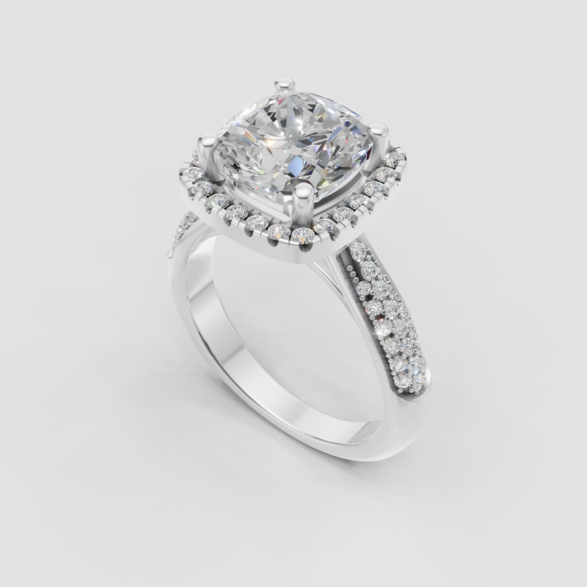 Cushion cut halo engagement ring with pavé-set yellow gold band