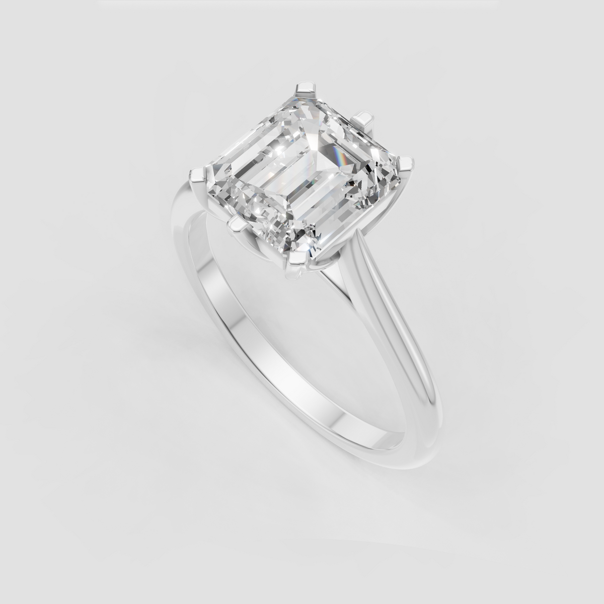 Emerald cut diamond ring with cathedral-inspired open gallery