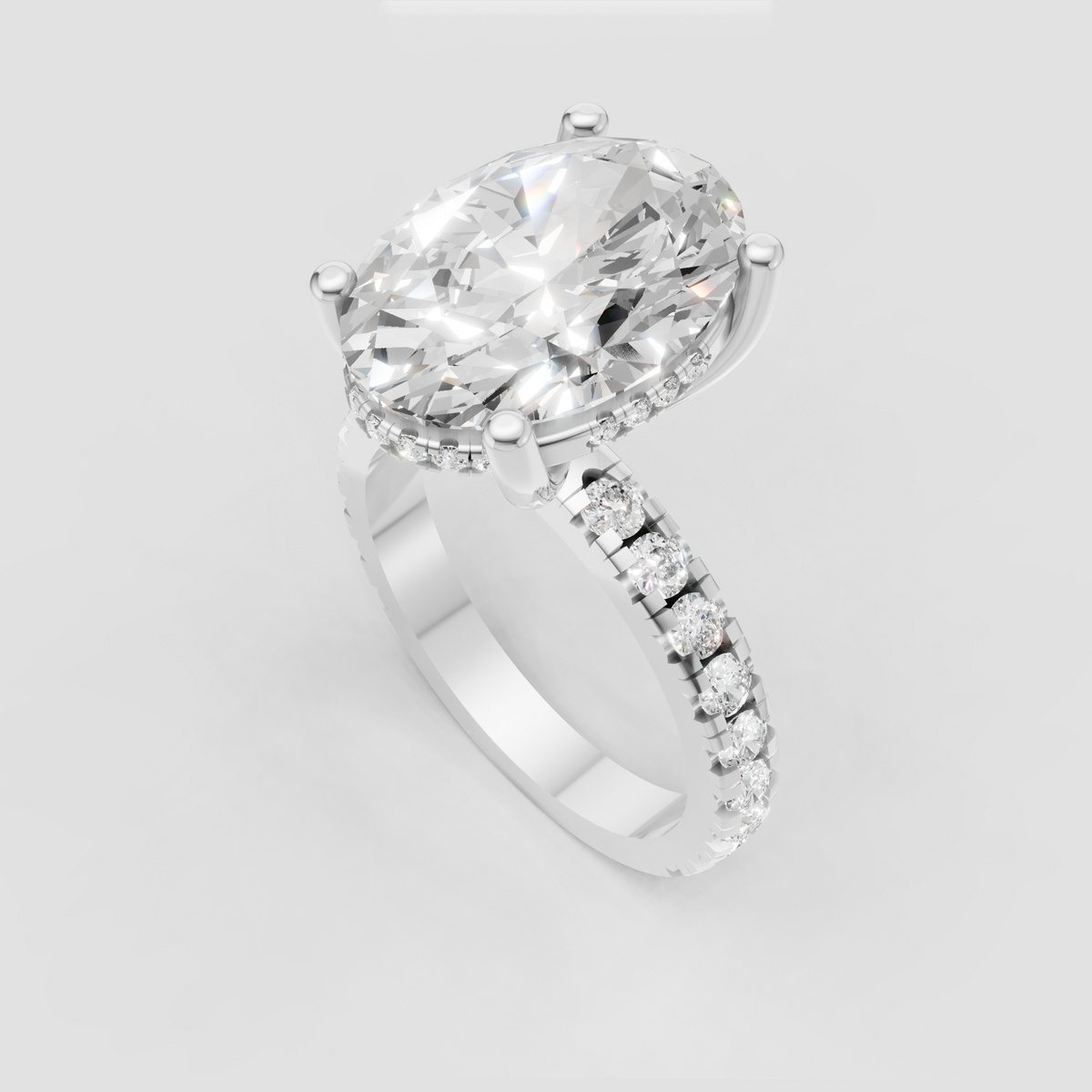 Oval center diamond ring with sparkling pavé shoulders