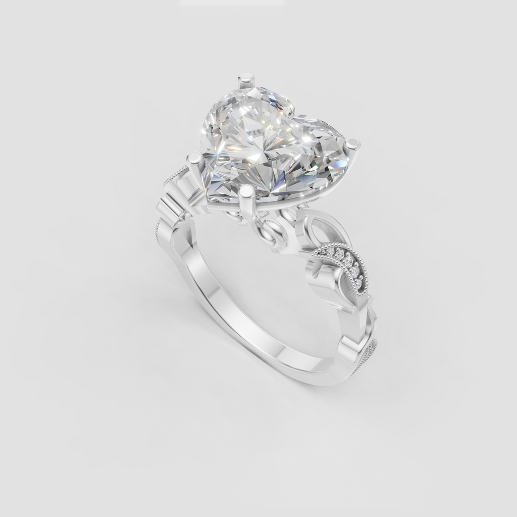 Heart cut diamond ring featuring ornate pavé side stones