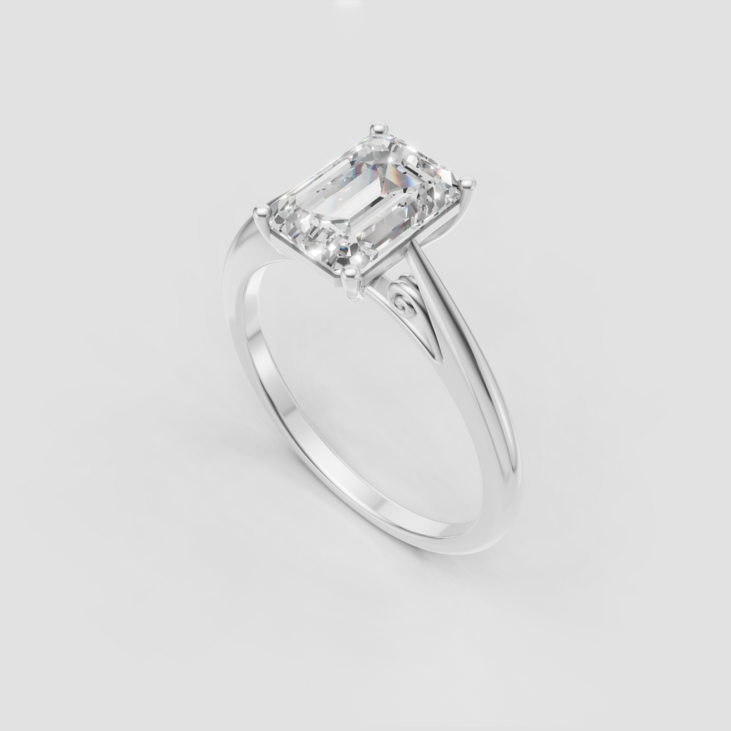 Emerald solitaire ring in polished yellow gold