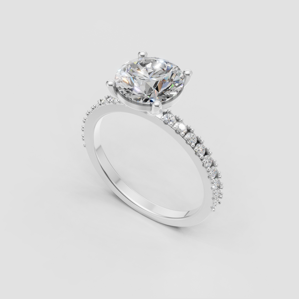 Four-prong oval diamond ring with half-eternity pave band