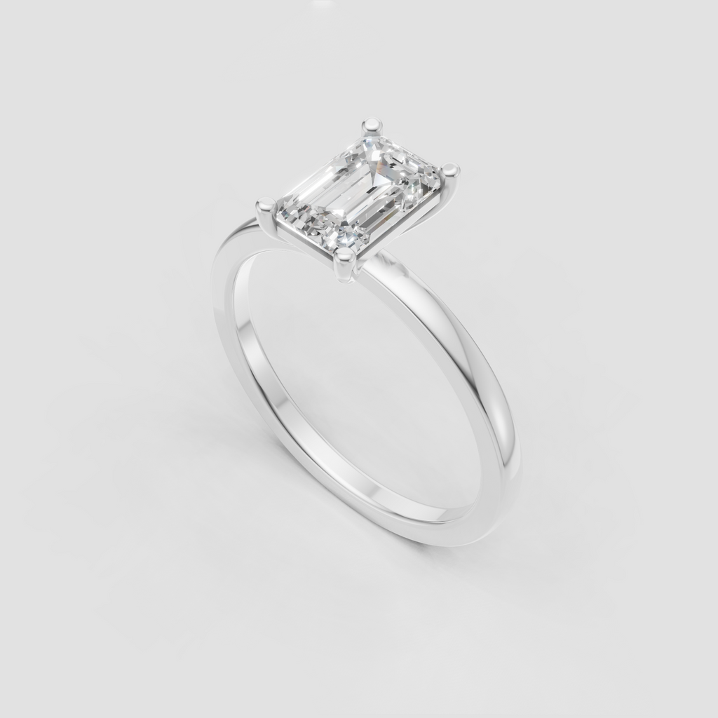 Classic emerald cut diamond ring with four rounded prongs