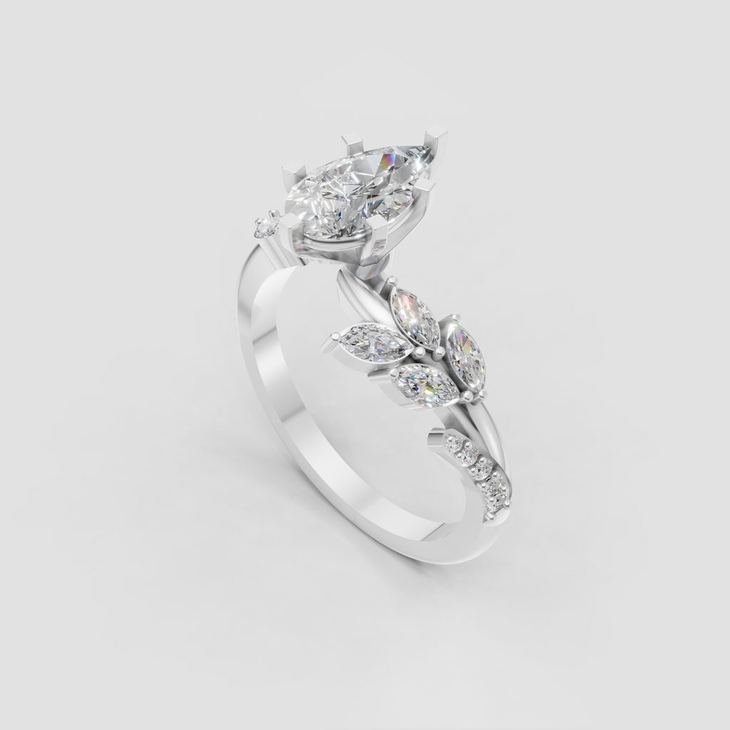 Pear diamond engagement ring featuring marquise and round accents