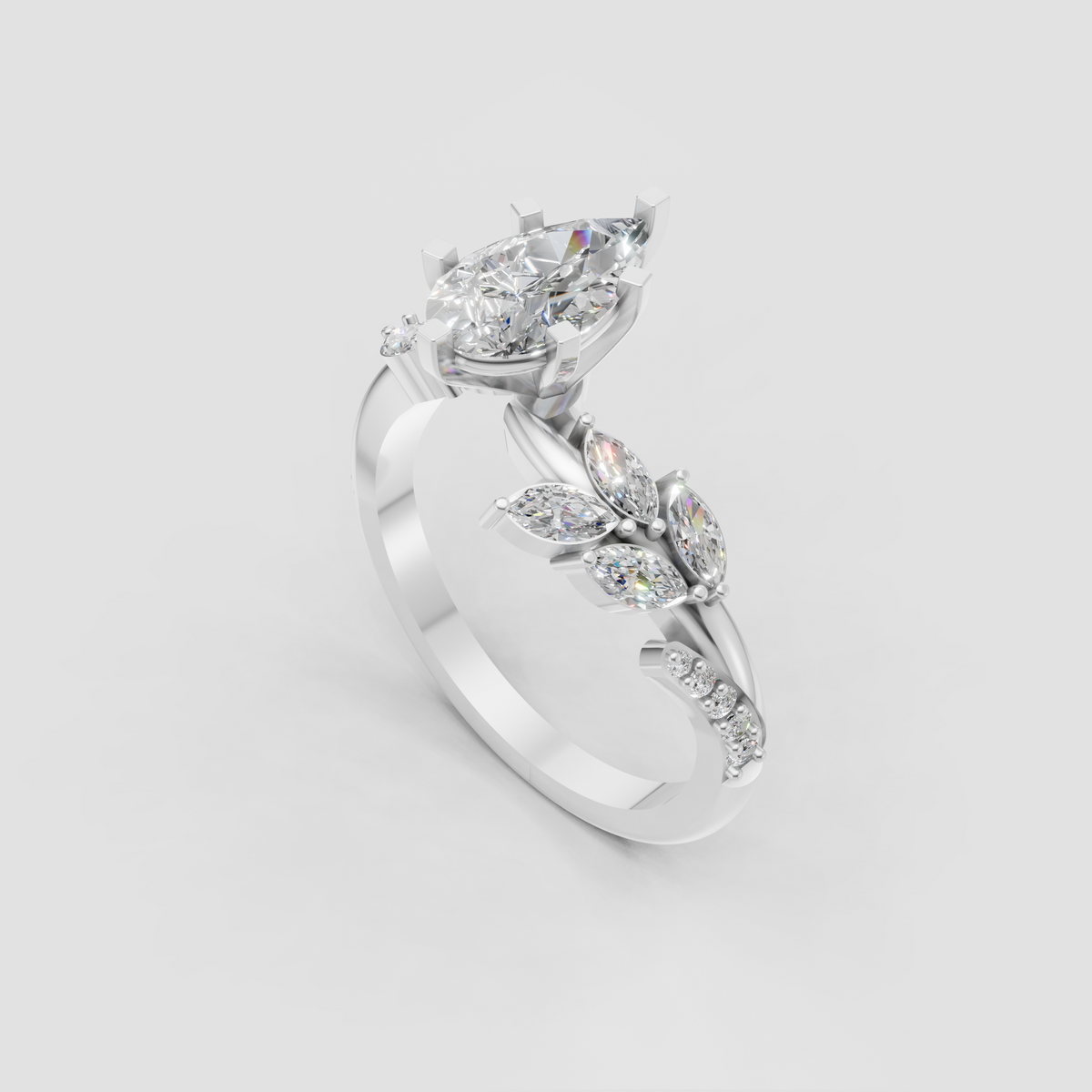 Pear diamond engagement ring featuring marquise and round accents