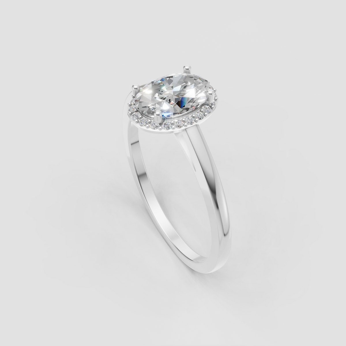 Four-prong oval diamond engagement ring with sparkling halo accents
