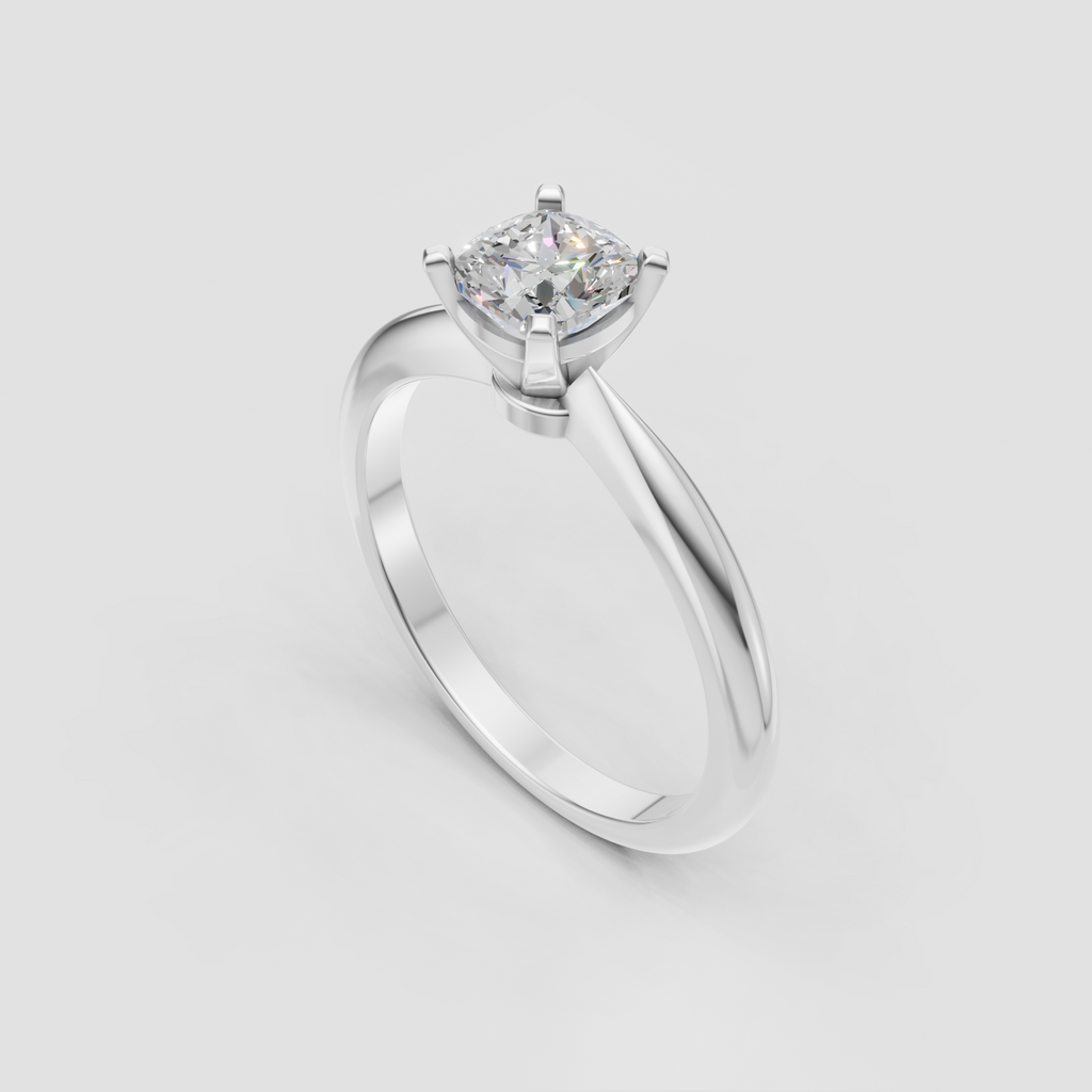 Four-prong cushion Diamond ring with tapered shoulders