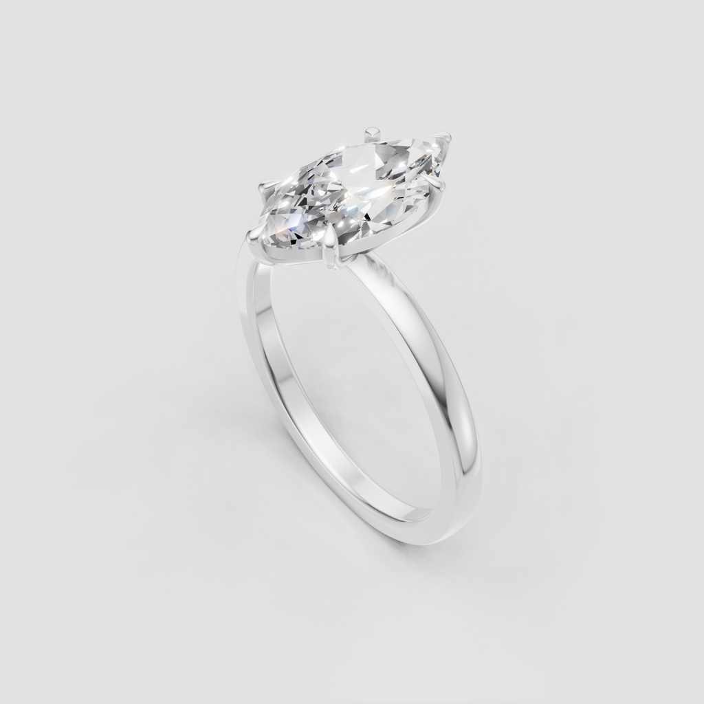 Elongated marquise diamond solitaire ring in warm yellow gold
