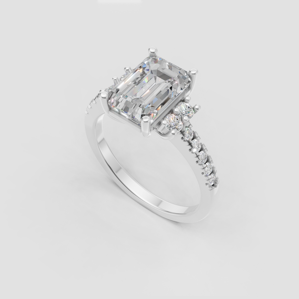 Emerald cut center stone ring with clustered side diamonds