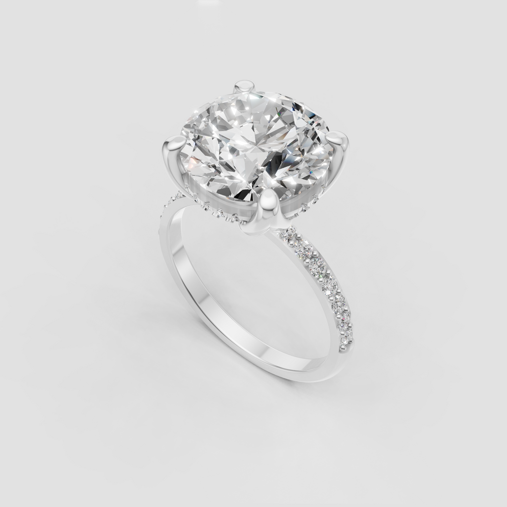 Round brilliant center diamond with six curved gold prongs