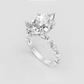 Yellow gold teardrop diamond ring with detailed accent stones