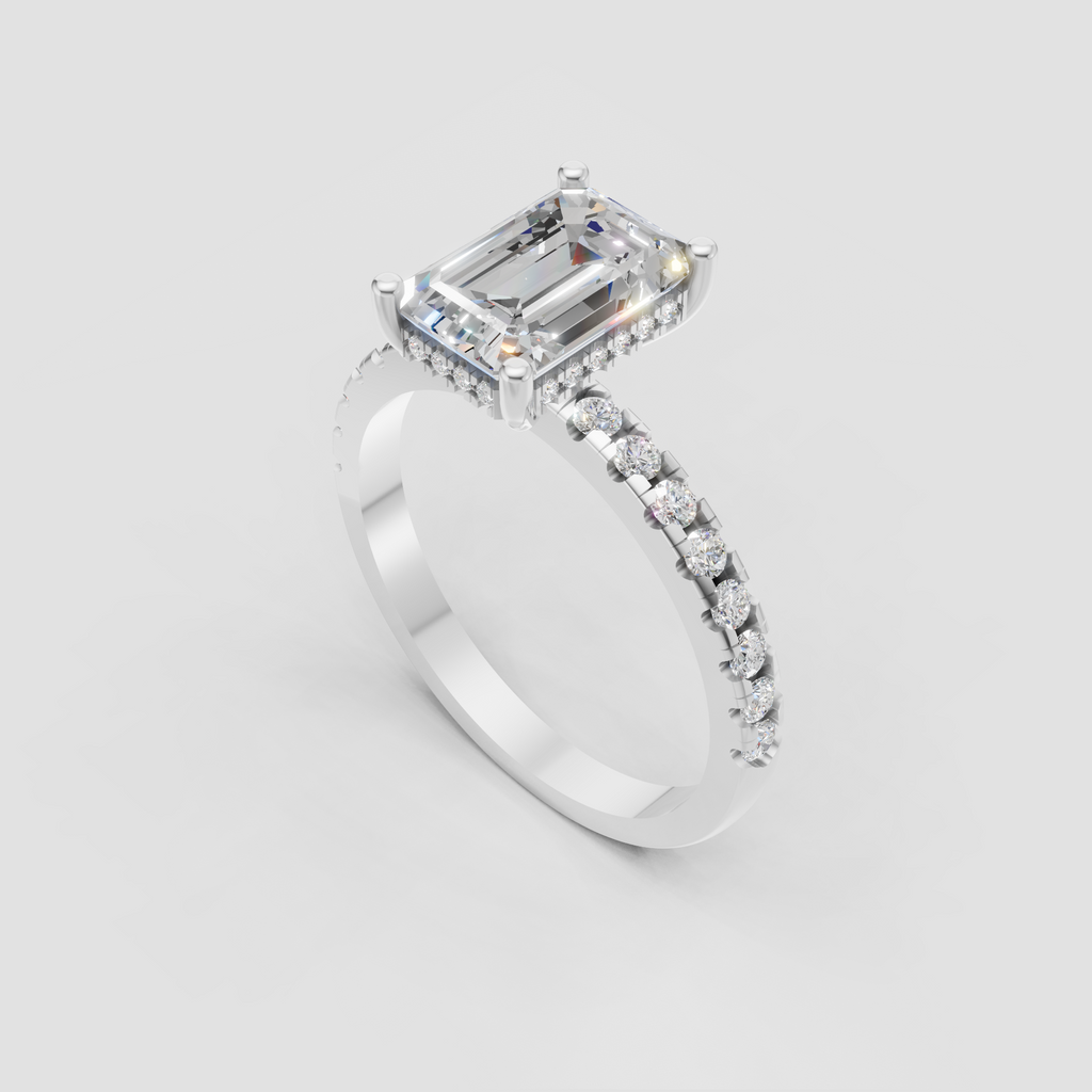 Emerald cut solitaire-style ring with four rounded prongs