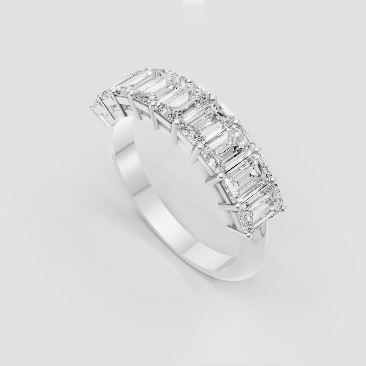 Emerald cut eternity wedding band with brilliant gemstones