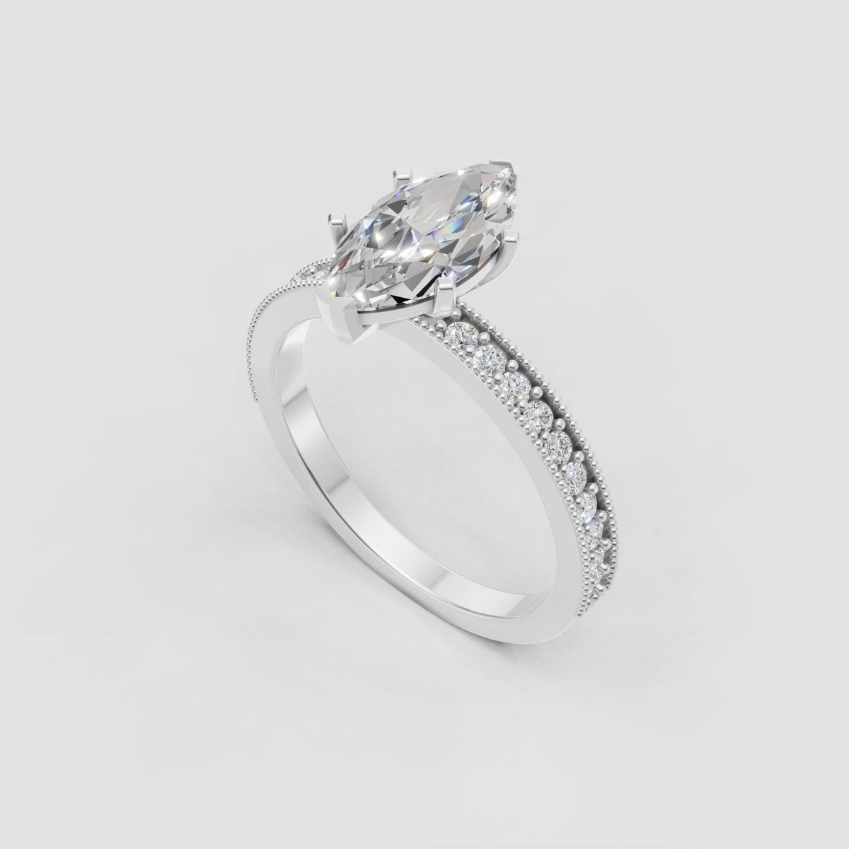 Vintage-inspired marquise diamond engagement ring with delicate pavé stones