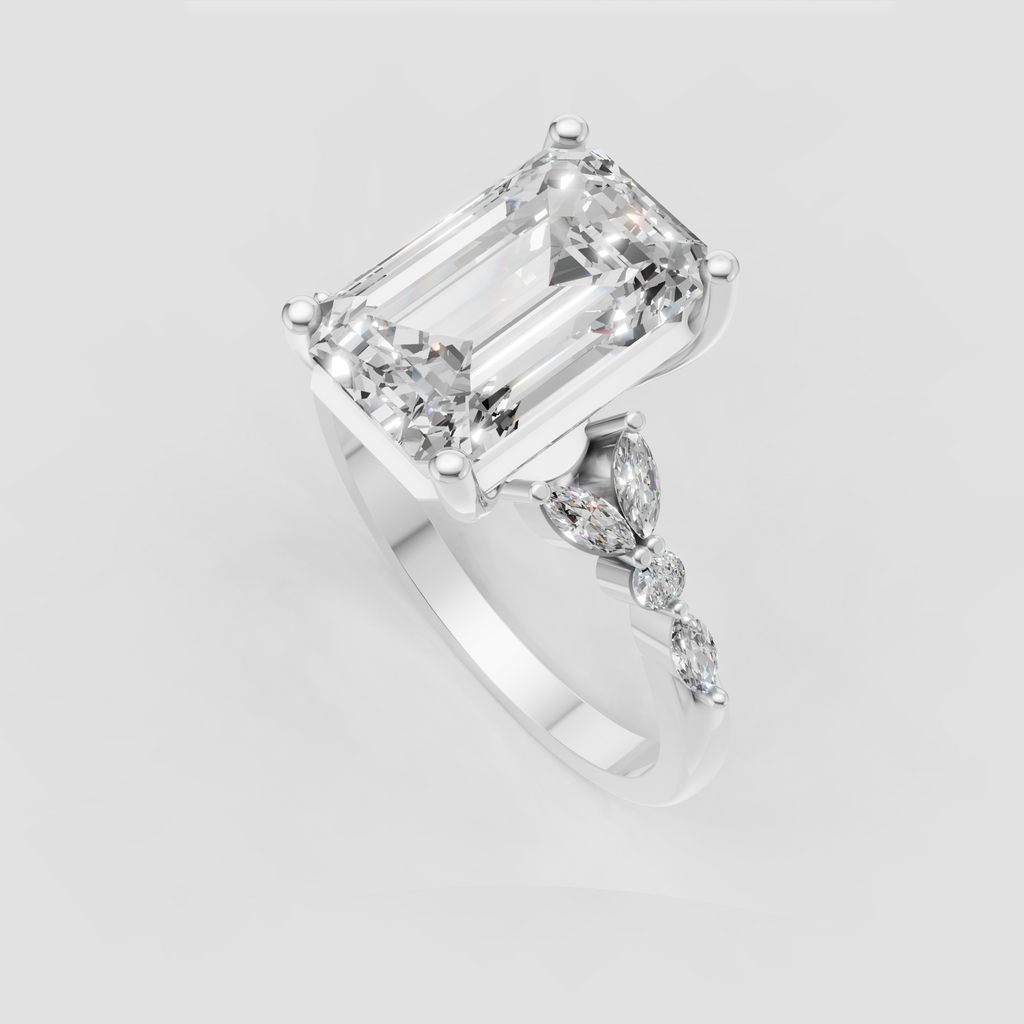 Emerald cut ring with marquise and round diamonds