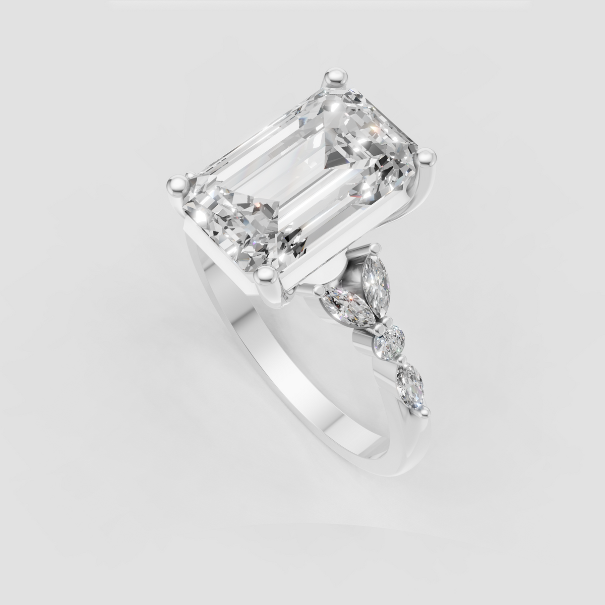 Emerald cut ring with marquise and round diamonds