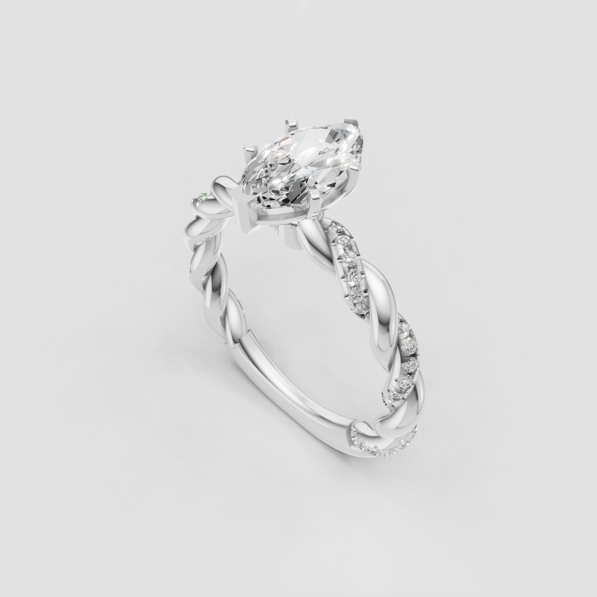 Marquise solitaire engagement ring with intertwined gold band