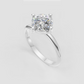 Round cut engagement ring featuring a polished twisted band