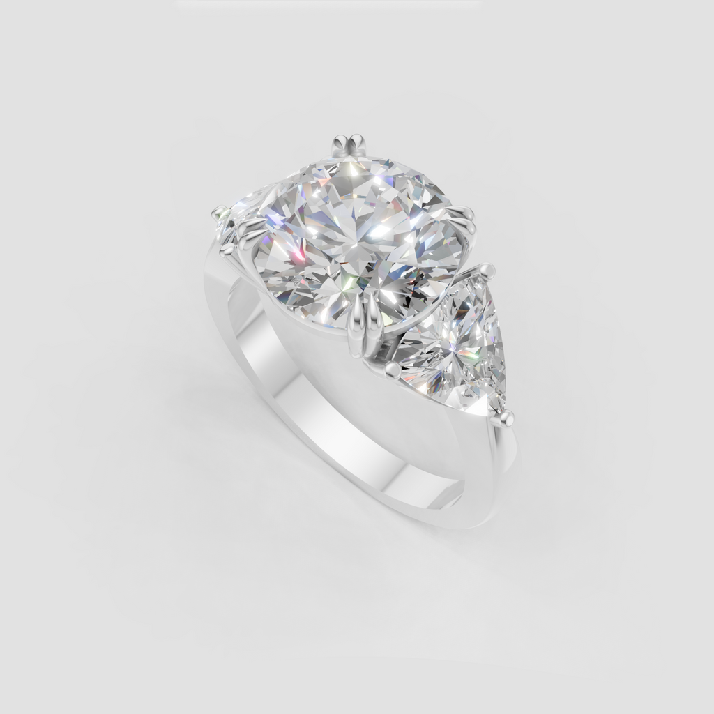 Luxury round cut diamond ring with pear side stones and yellow gold setting