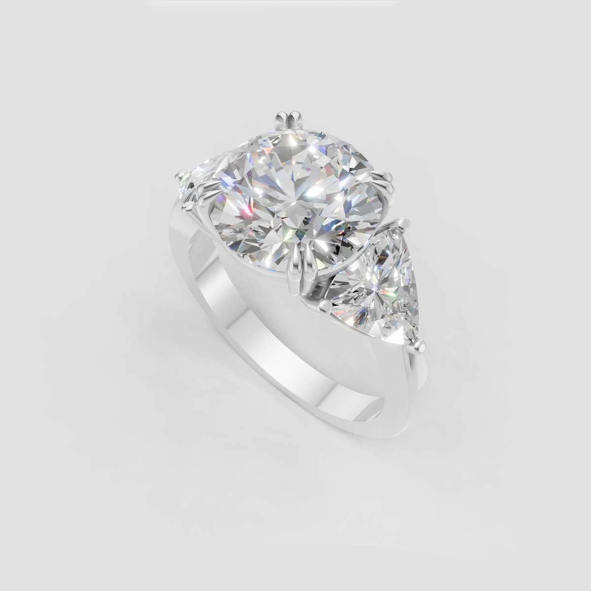 Luxury round cut diamond ring with pear side stones and yellow gold setting