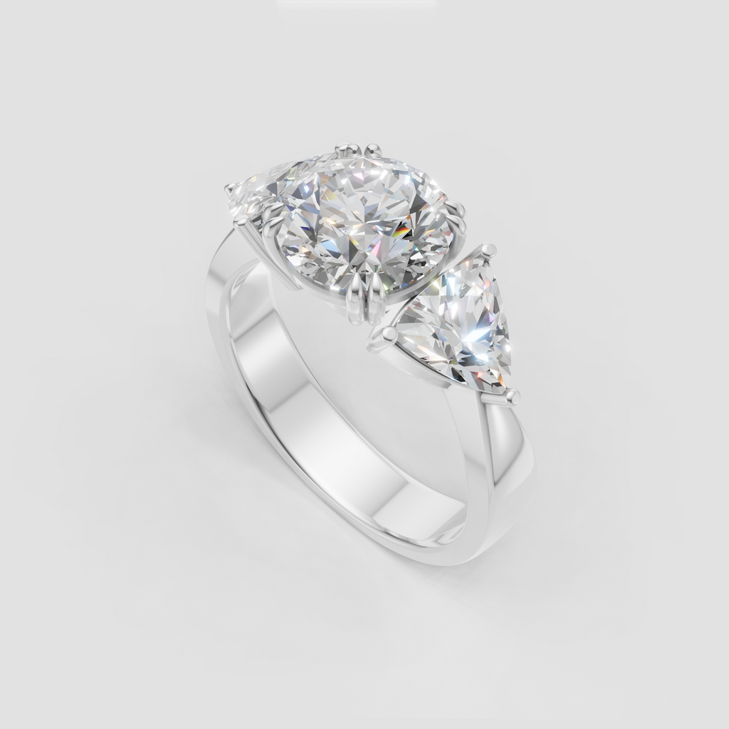 Elegant gold three-stone diamond engagement ring with Trillion accents