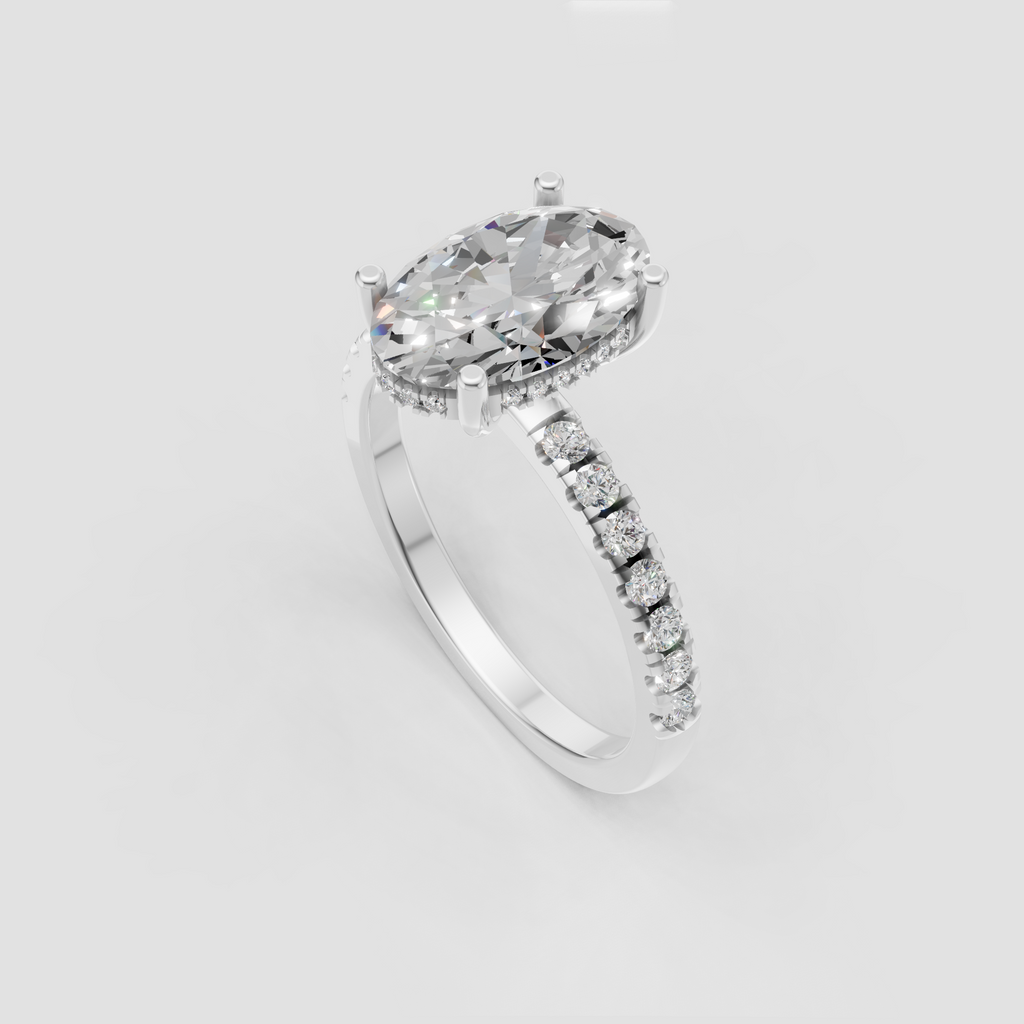 Oval diamond ring featuring hidden halo and sparkling pavé shoulders