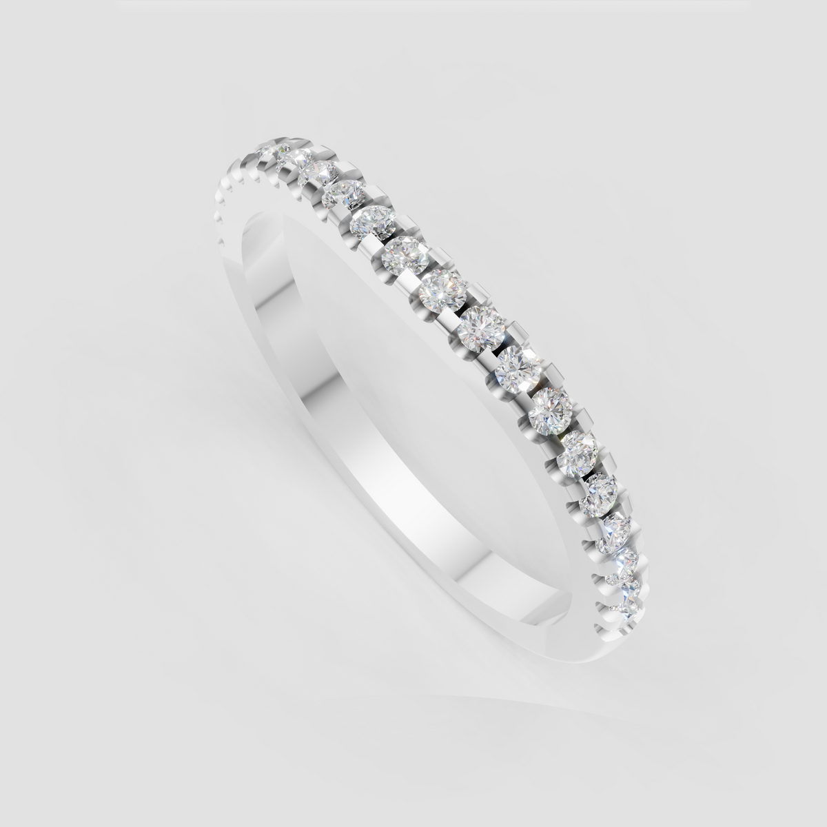 Shared prong round diamond eternity band close-up