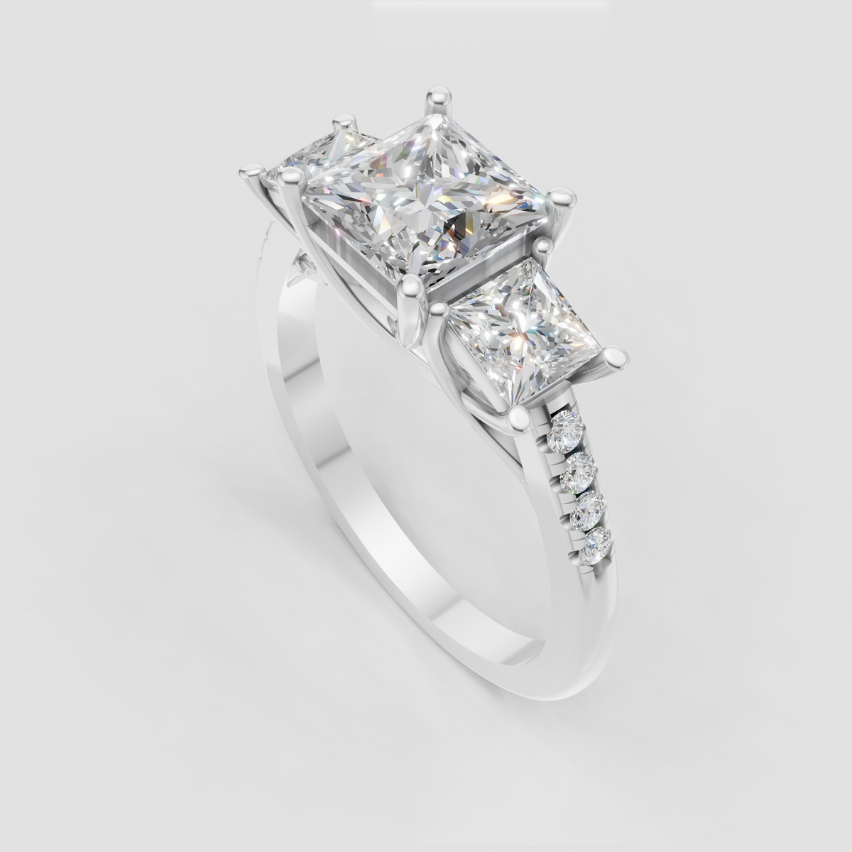 Yellow gold princess cut diamond ring with three-stone prong setting