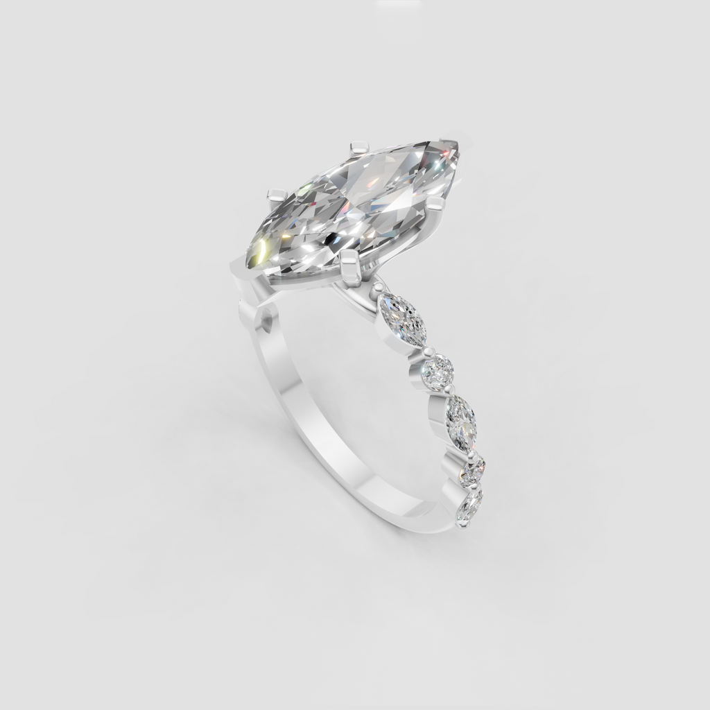 Yellow gold marquise cut diamond engagement ring with four-prong setting.