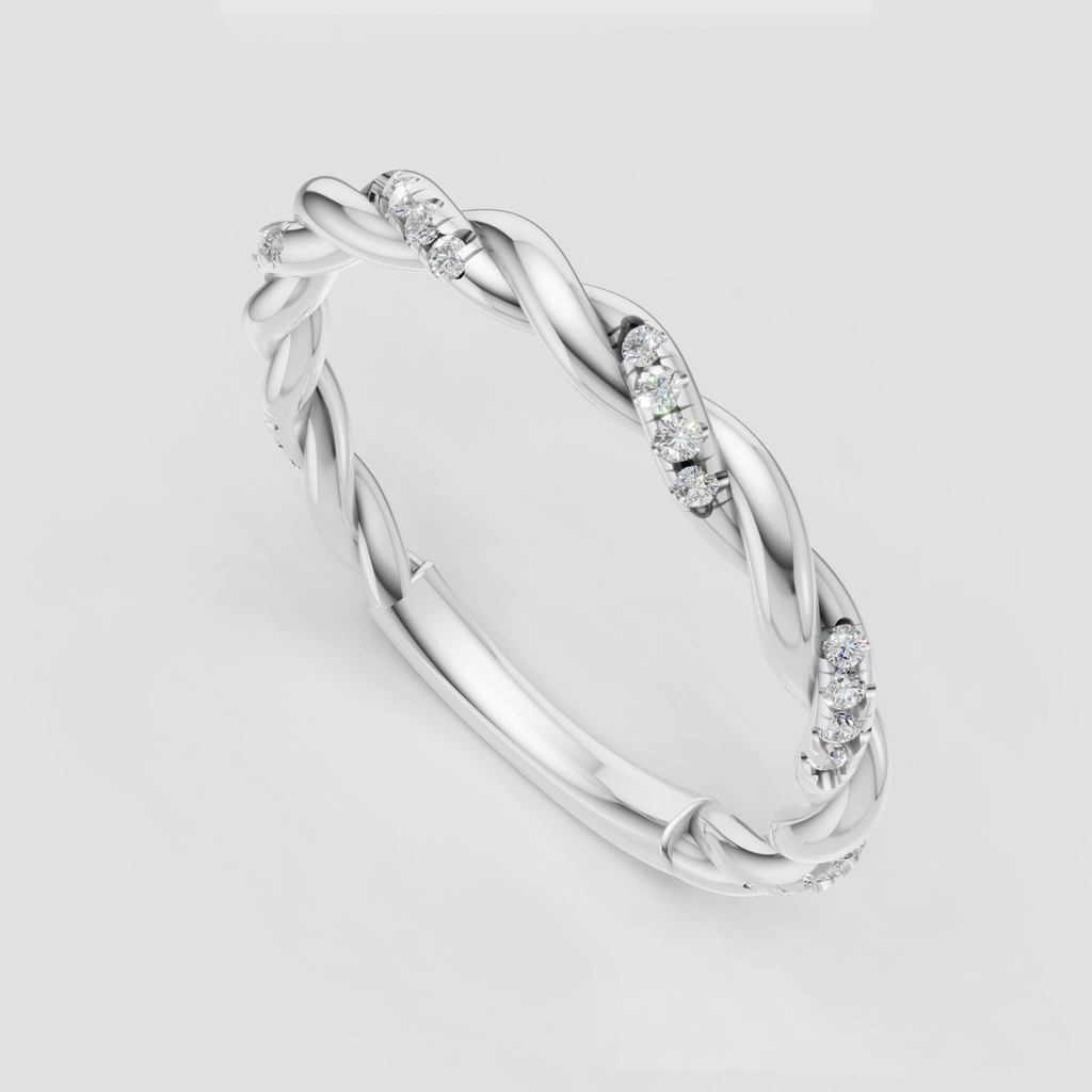 Sculptural twisted gold band with diamond accents