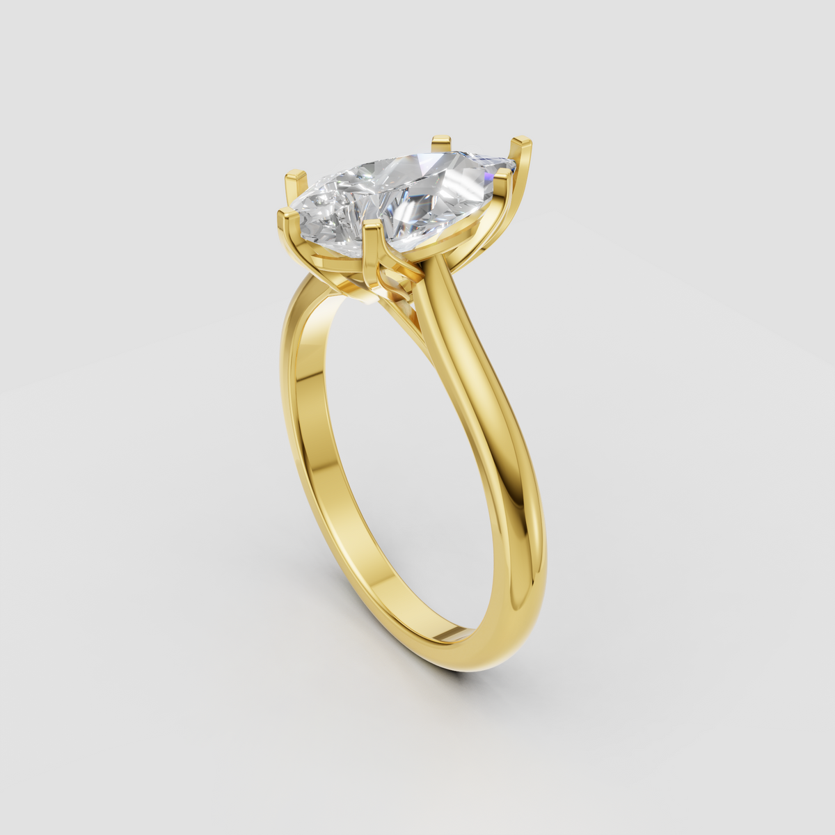 Yellow gold pear cut diamond engagement ring with six-prong setting