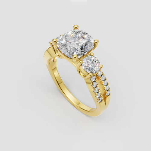 Yellow gold cushion cut three stone engagement ring
